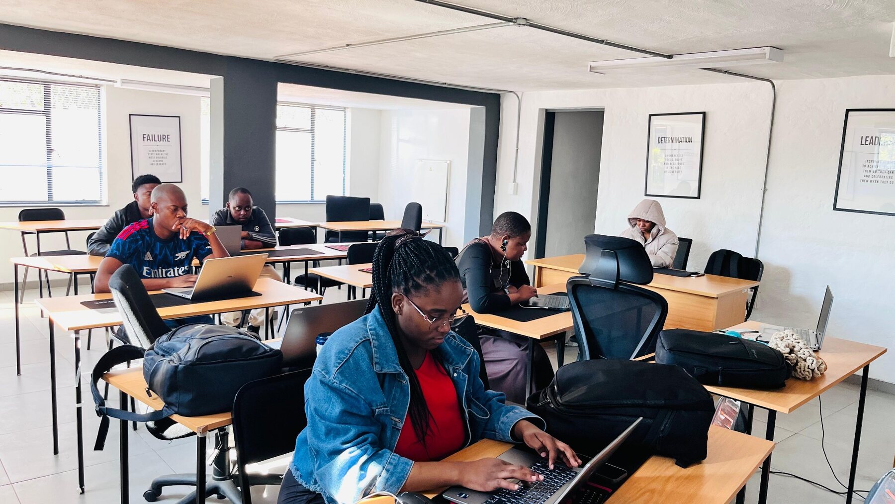 Rofane Academy learners completing practical coursework in a modern classroom